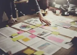 ideas laid out on paper on a table