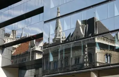 old building reflected in office windows