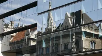 old building reflected in office windows